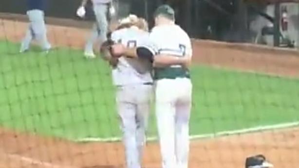 High school pitcher consoles friend after striking him out