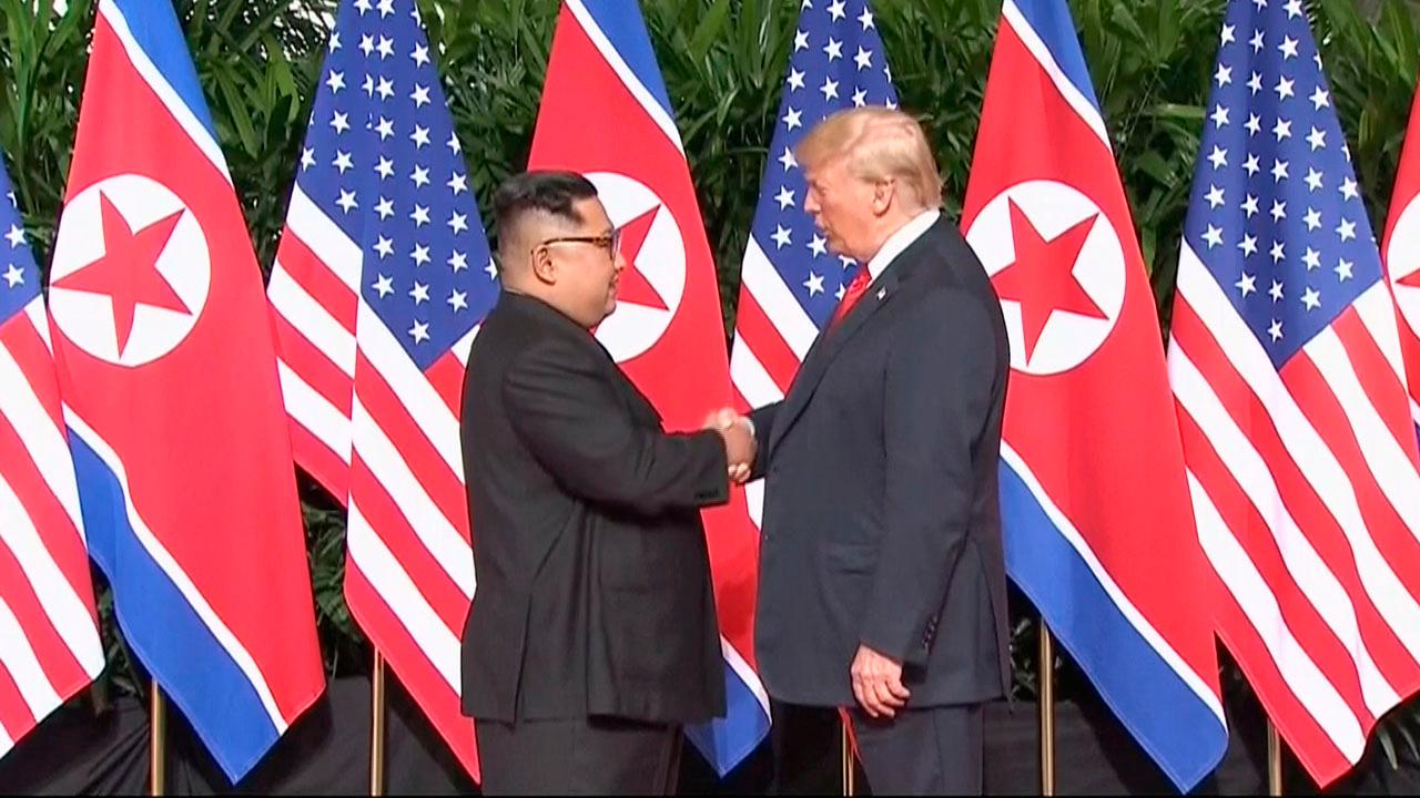 President Trump and Kim shake hands on landmark agreement