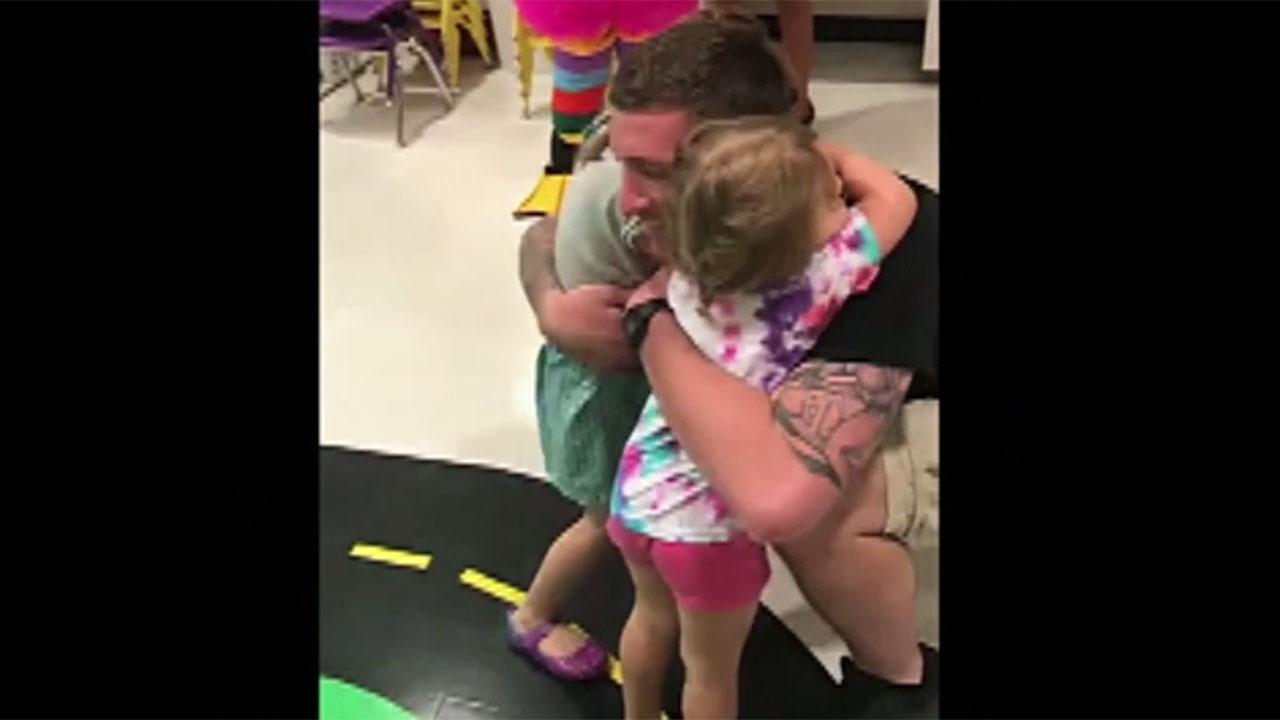 Little girls get surprise of lifetime when Army dad returns home