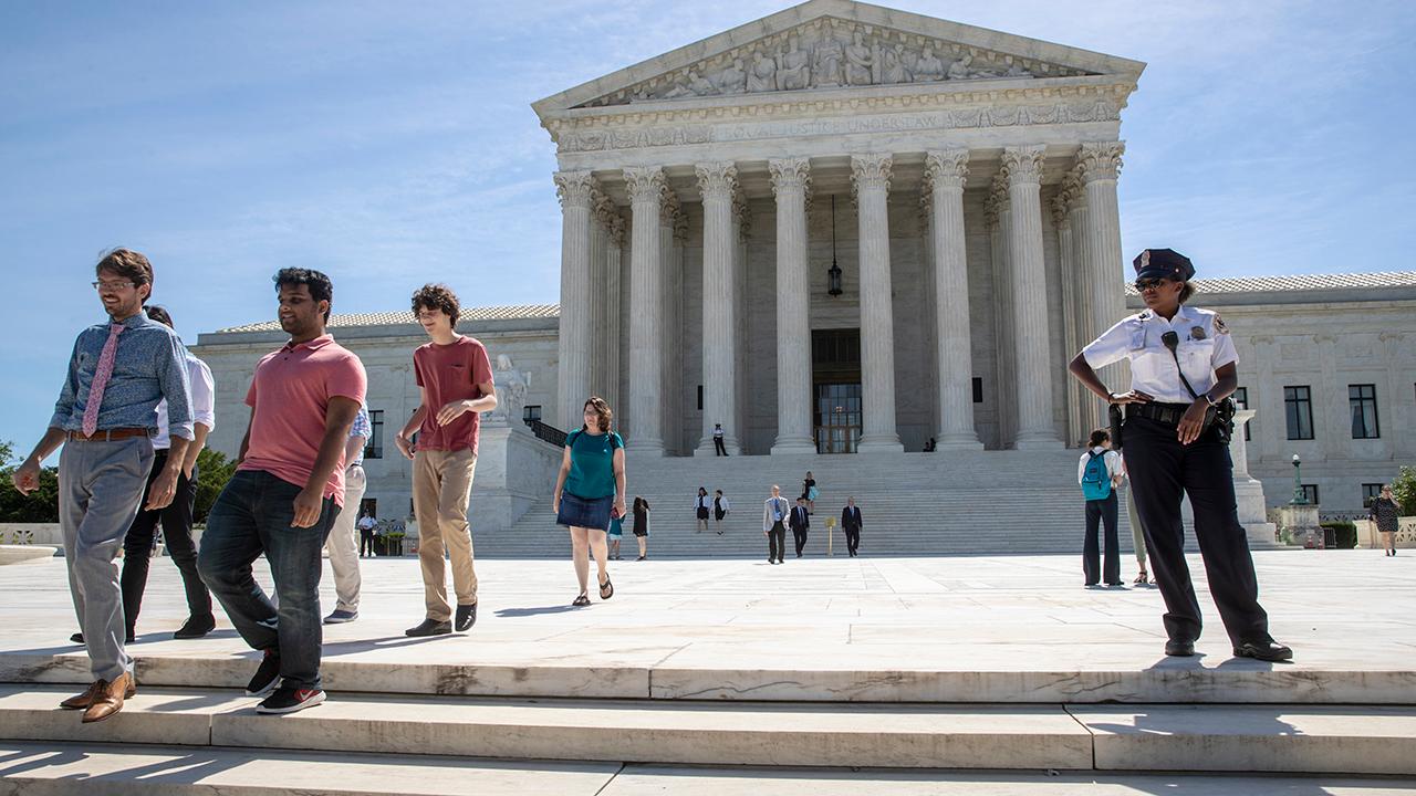 Critics balk at Supreme Court upholding Trump's travel ban