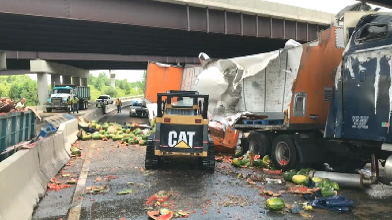 Raw video: Tractor-trailer carrying watermelons overturns