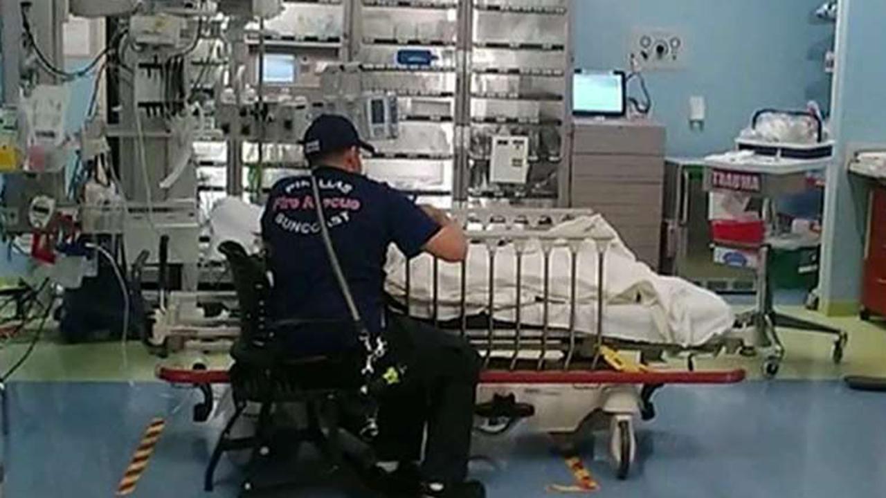 Paramedic stays by girl's side in hospital