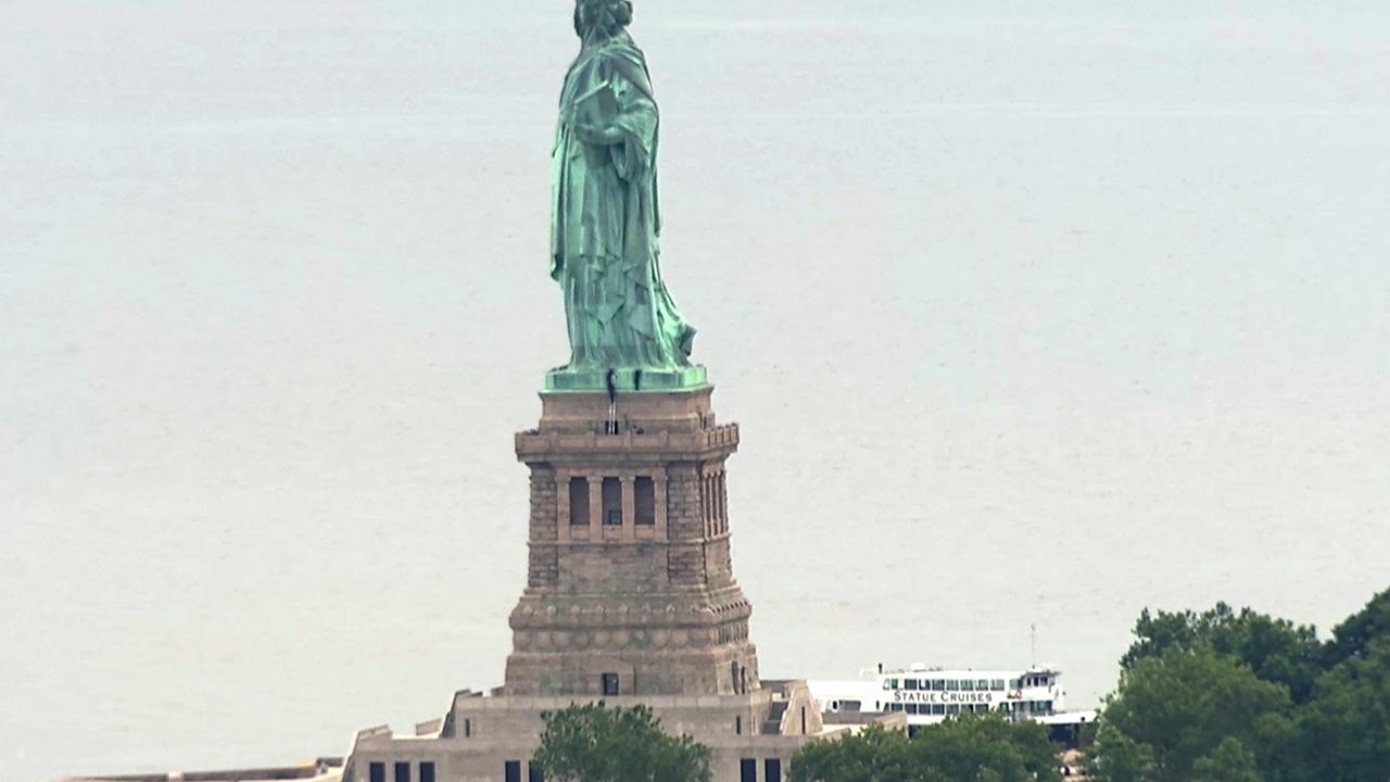 Woman scales Statue of Liberty in anti-ICE protest