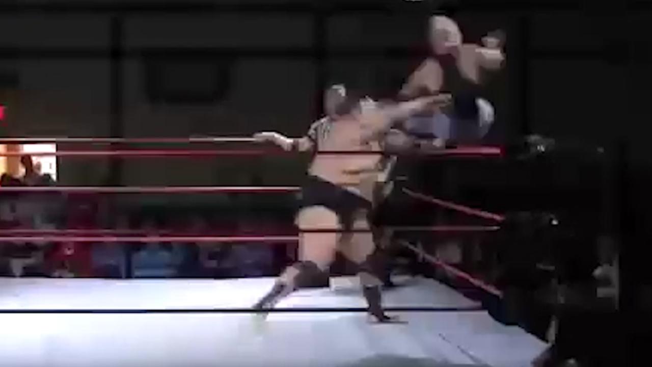 Wrestler violently launches opponent out of the ring