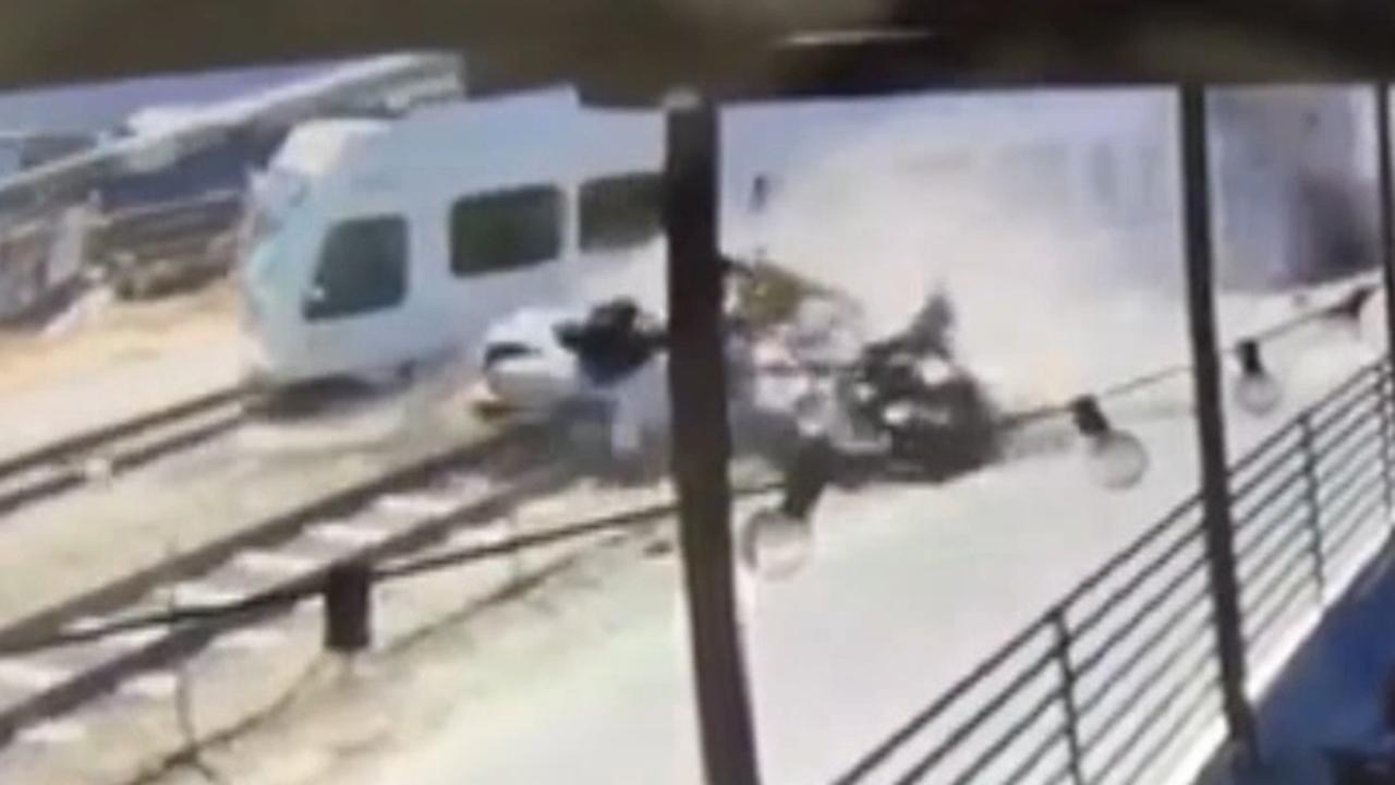 Deadly collision between car and train caught on camera