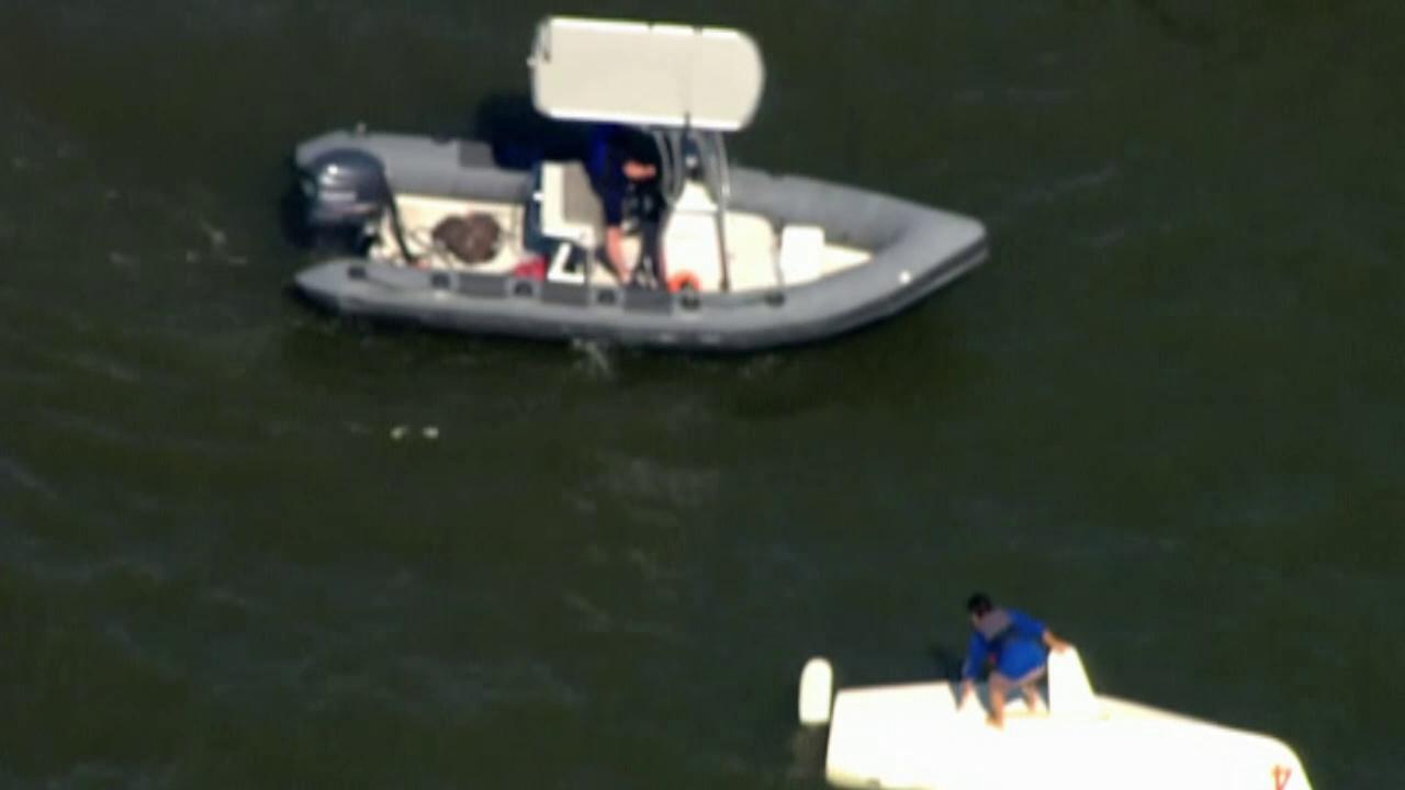 NYPD rescues man from overturned boat