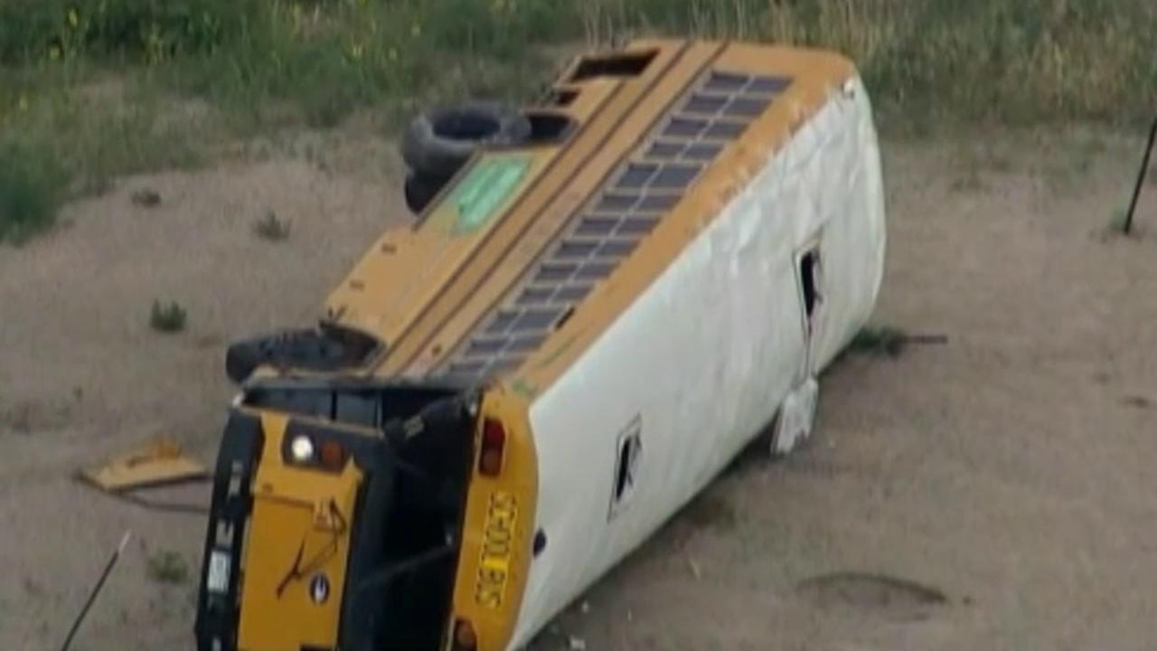 Raw video: Crash leaves Colorado school bus on its side