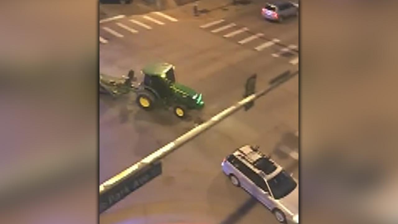 Raw video: Police pursue tractor through Denver 
