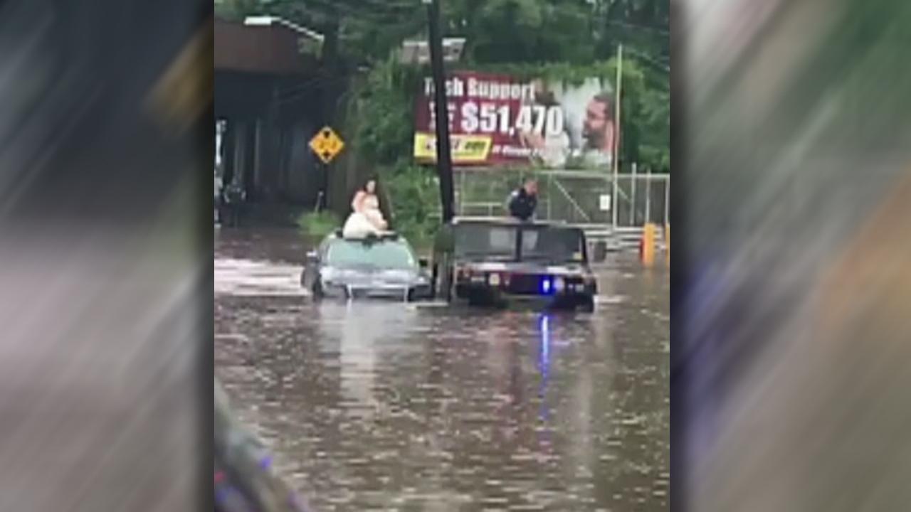 New Jersey police rescue bride from rising flood waters