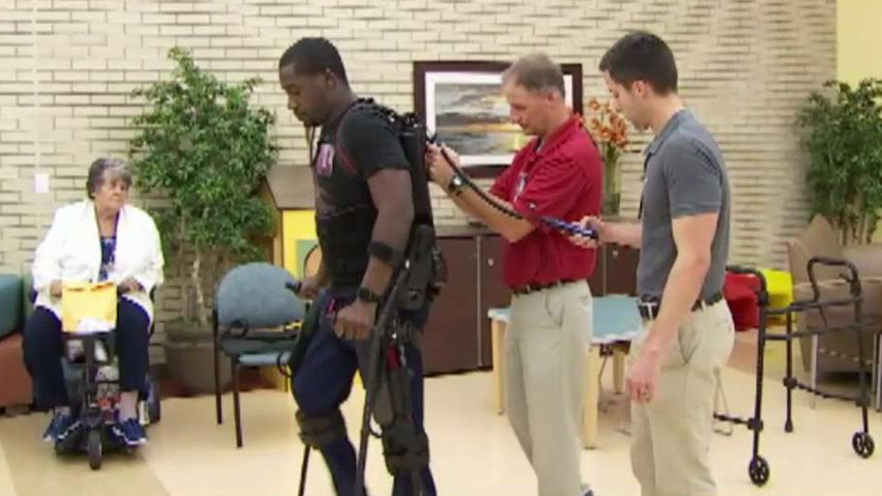 Exoskeleton suit helps paralyzed Navy veteran walk again