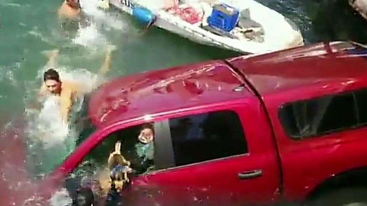 Good Samaritans save mother, son and dog from sinking truck