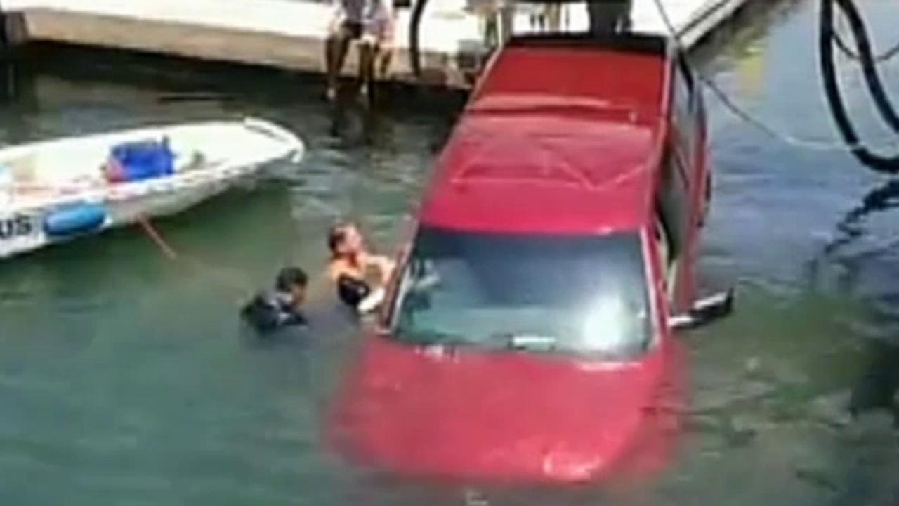 Rescuers save mother, son from sinking pickup truck