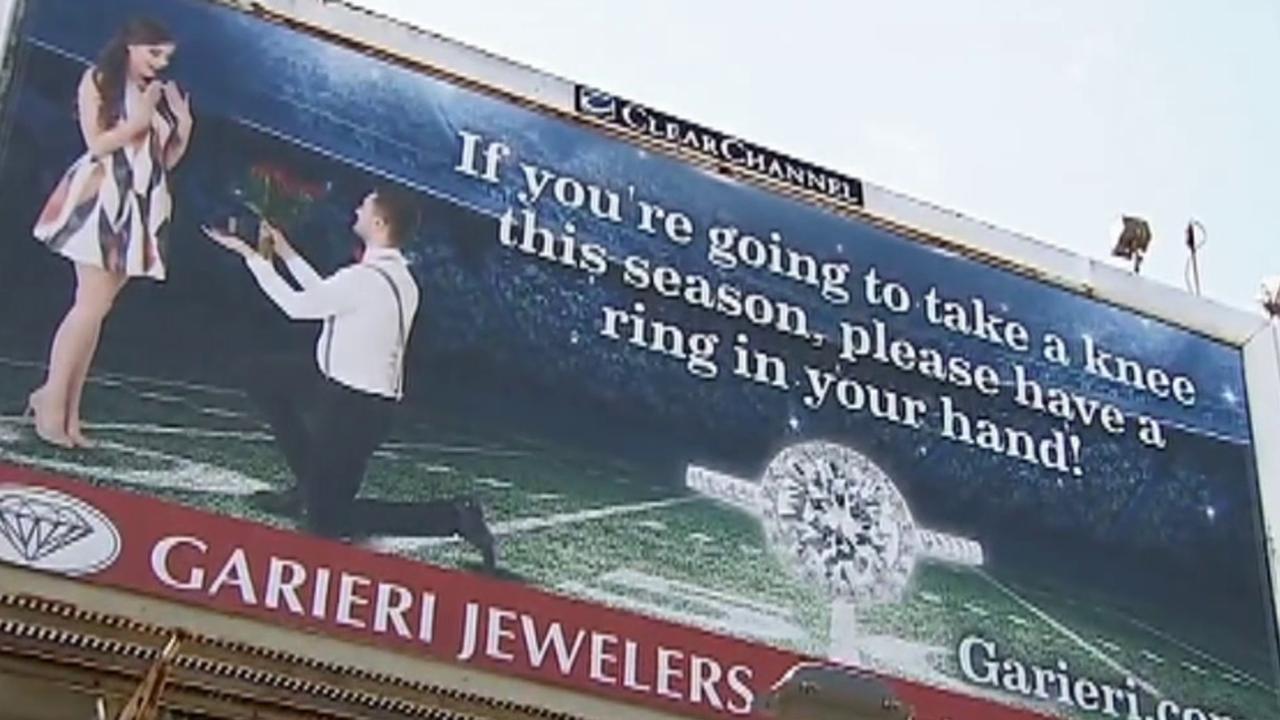 Jewelry store's 'kneeling' billboard draws backlash