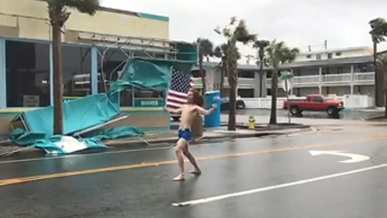 Florida man with US flag takes on Hurricane Florence 