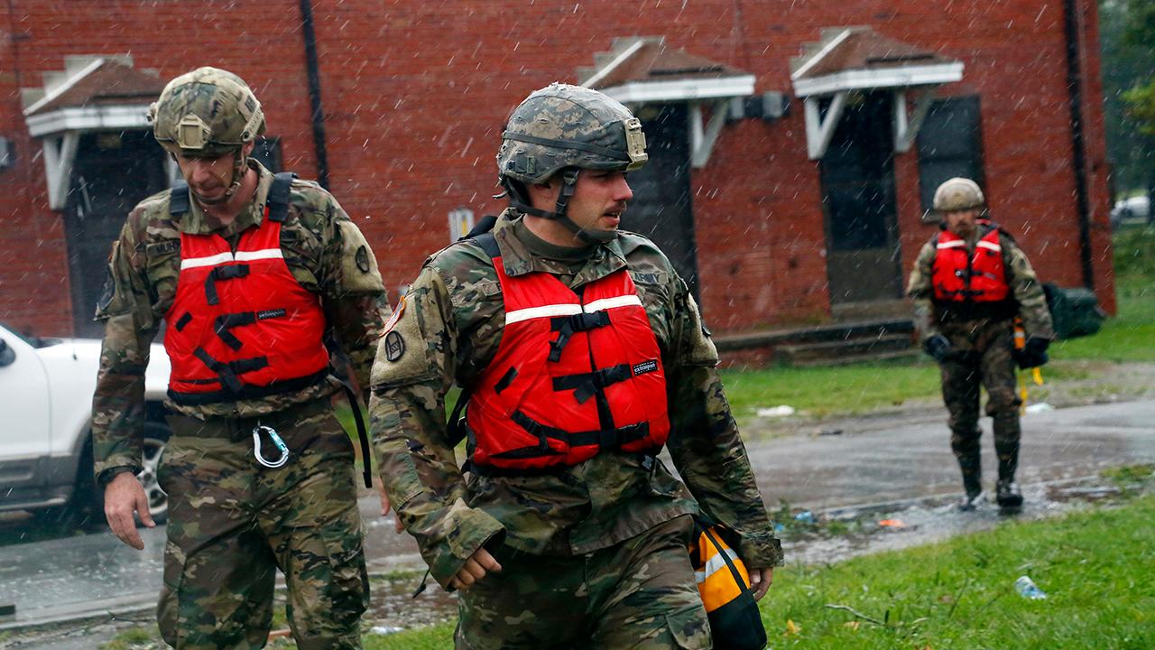 First responders work to rescue people trapped by Florence