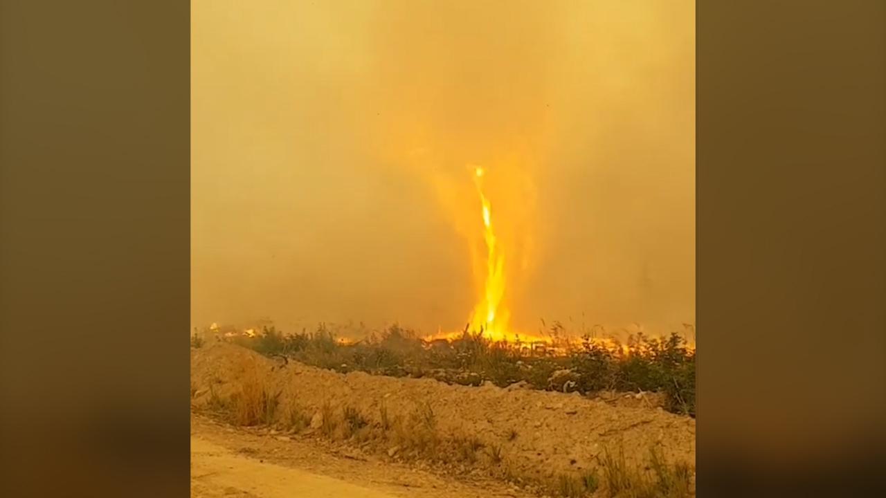 Incredible Video: ‘Firenado’ engulfs firefighter hose