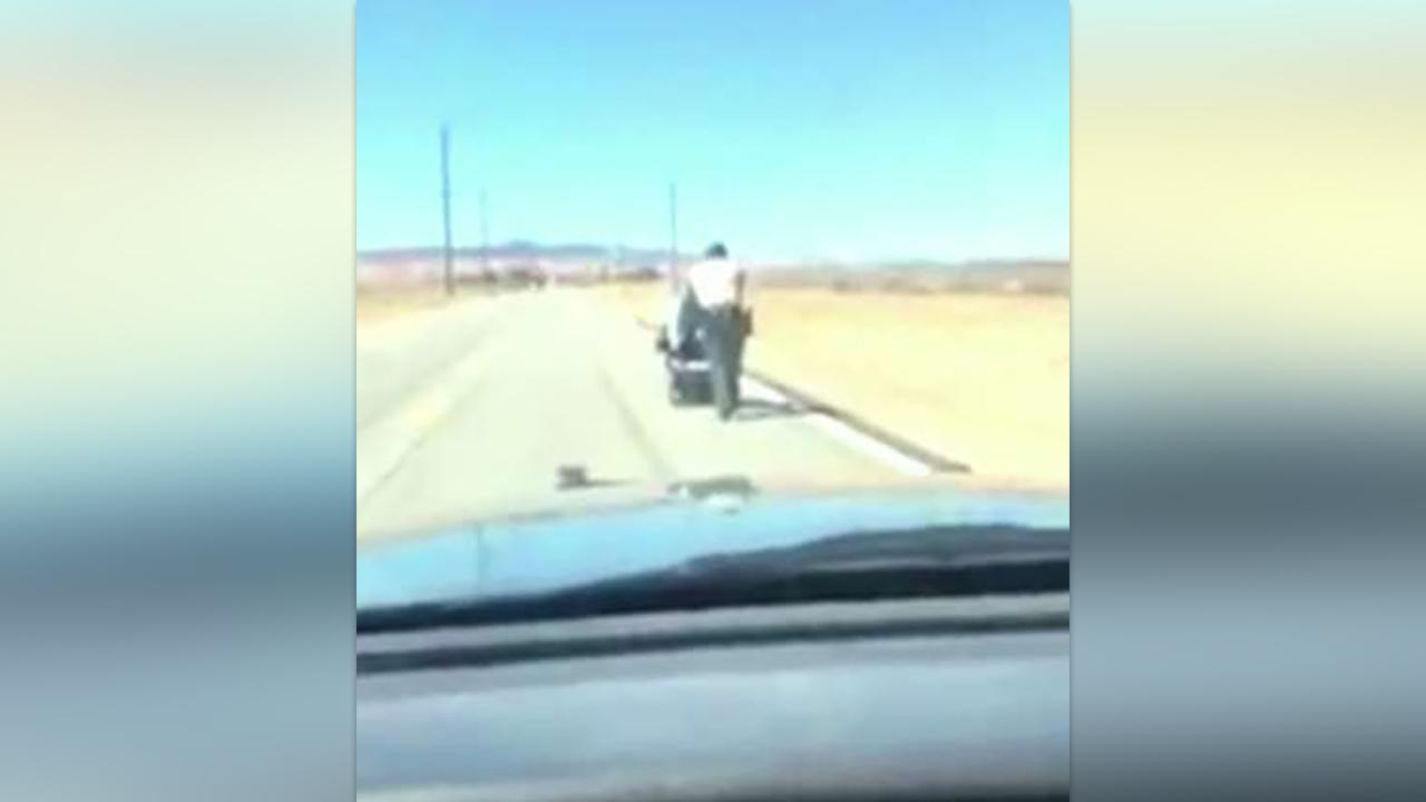 Officer pushes stranded woman's wheelchair home