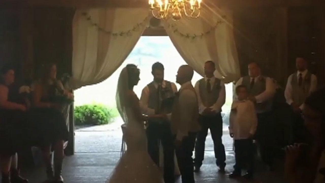 Wedding photographer shoves a bride's step mother