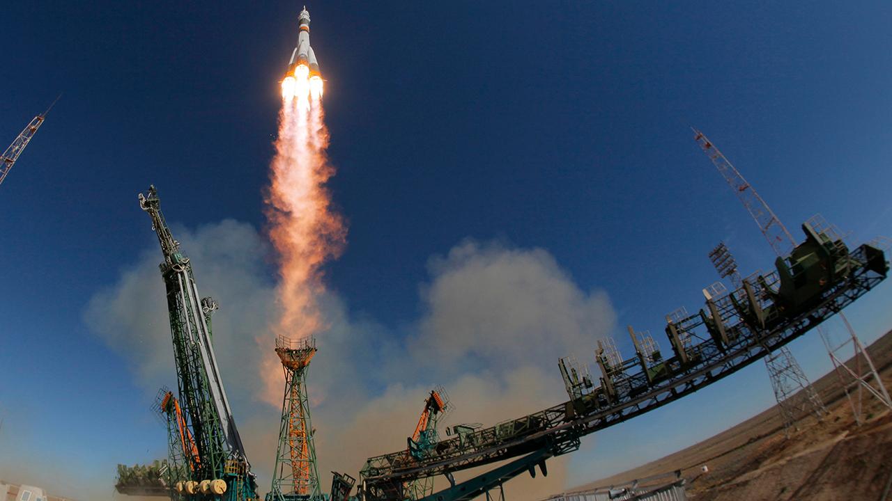 Astronauts safe after aborting booster rocket launch