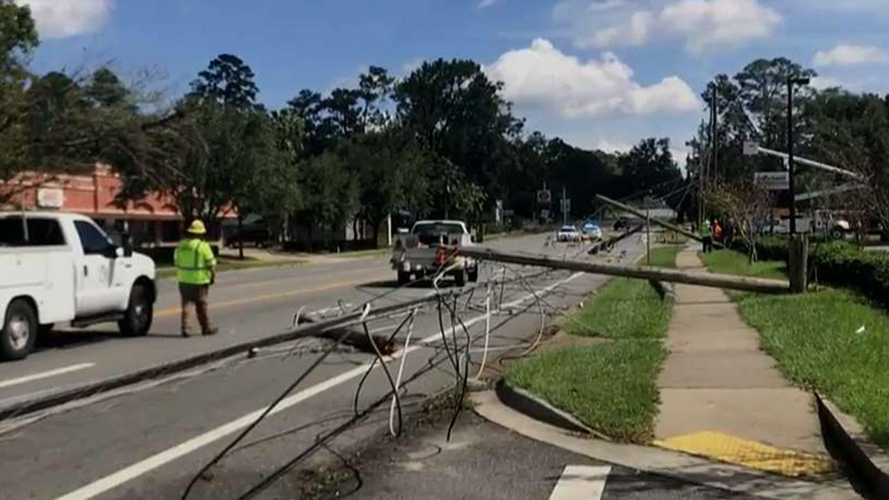 Crews work to clear power lines downed by Hurricane Michael
