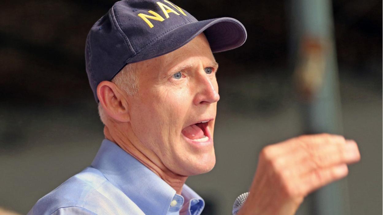 Rick Scott criticized for Navy hat