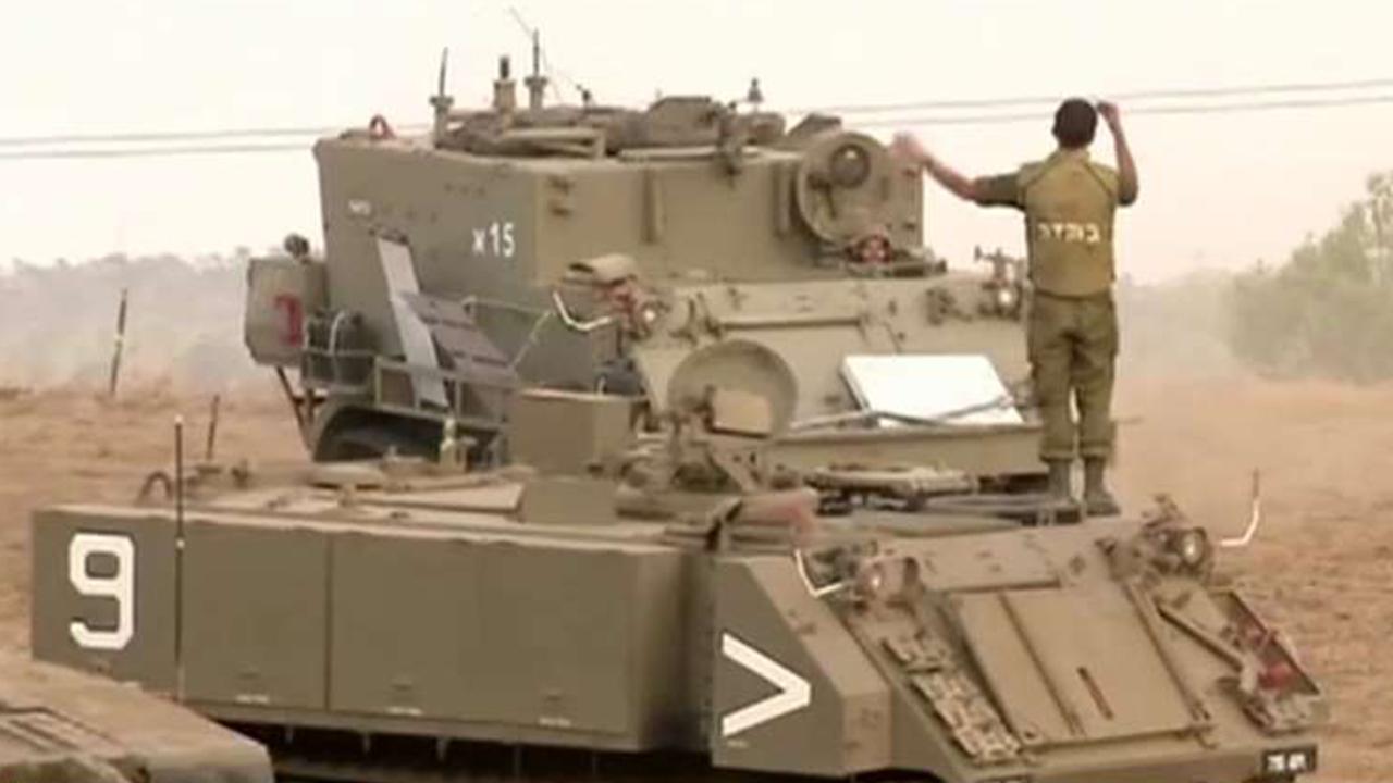 Israel gathers tanks on Gaza border to send message to Hamas