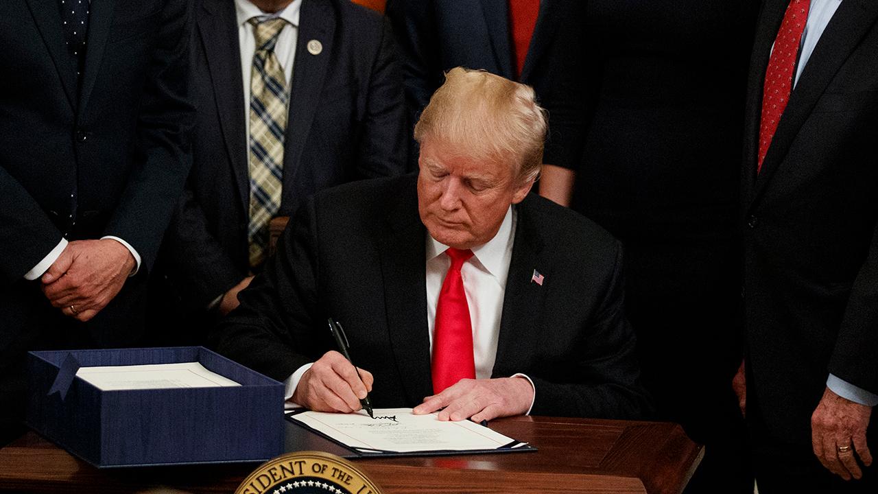 Trump signs bill to curb opioid epidemic