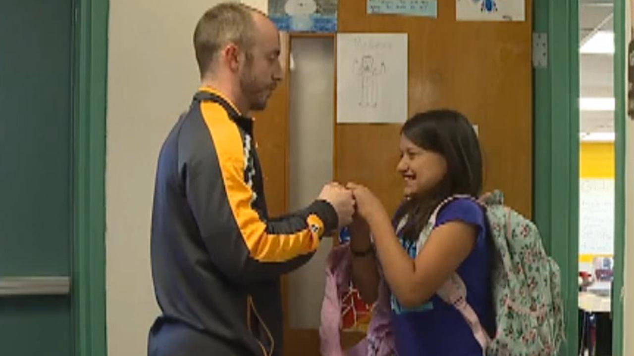 Teacher's unique handshakes go viral