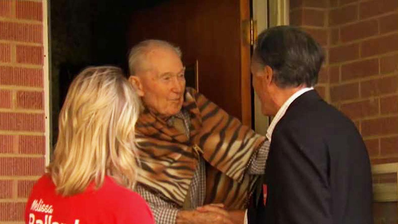 Mitt Romney goes door-to-door as he canvasses Salt Lake City