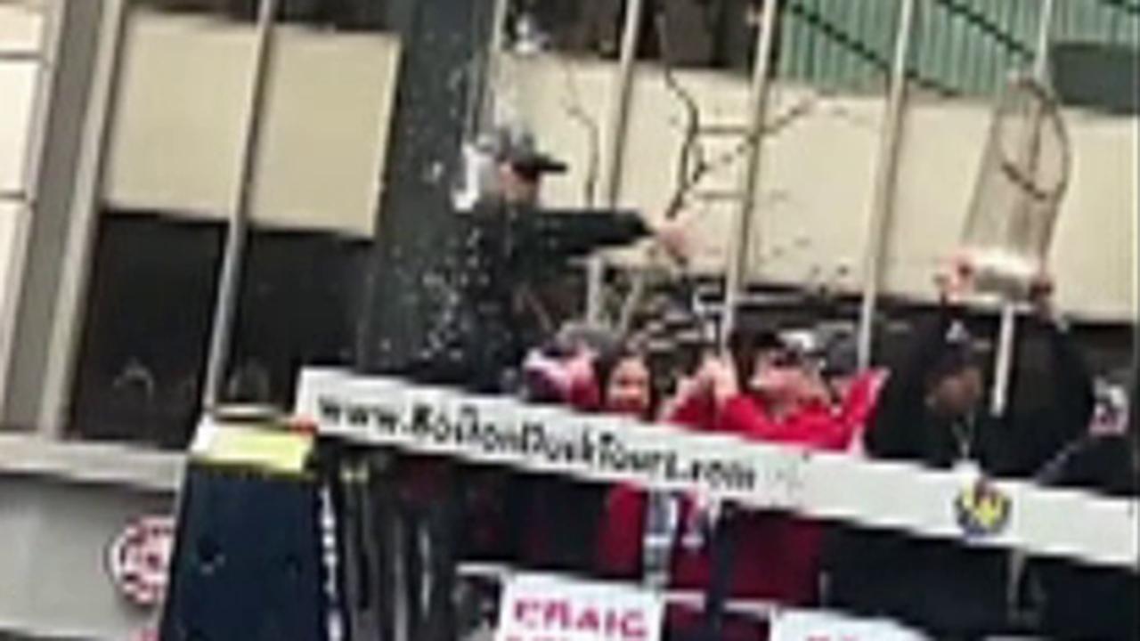 Raw video: Red Sox manager hit by cans of beer during parade