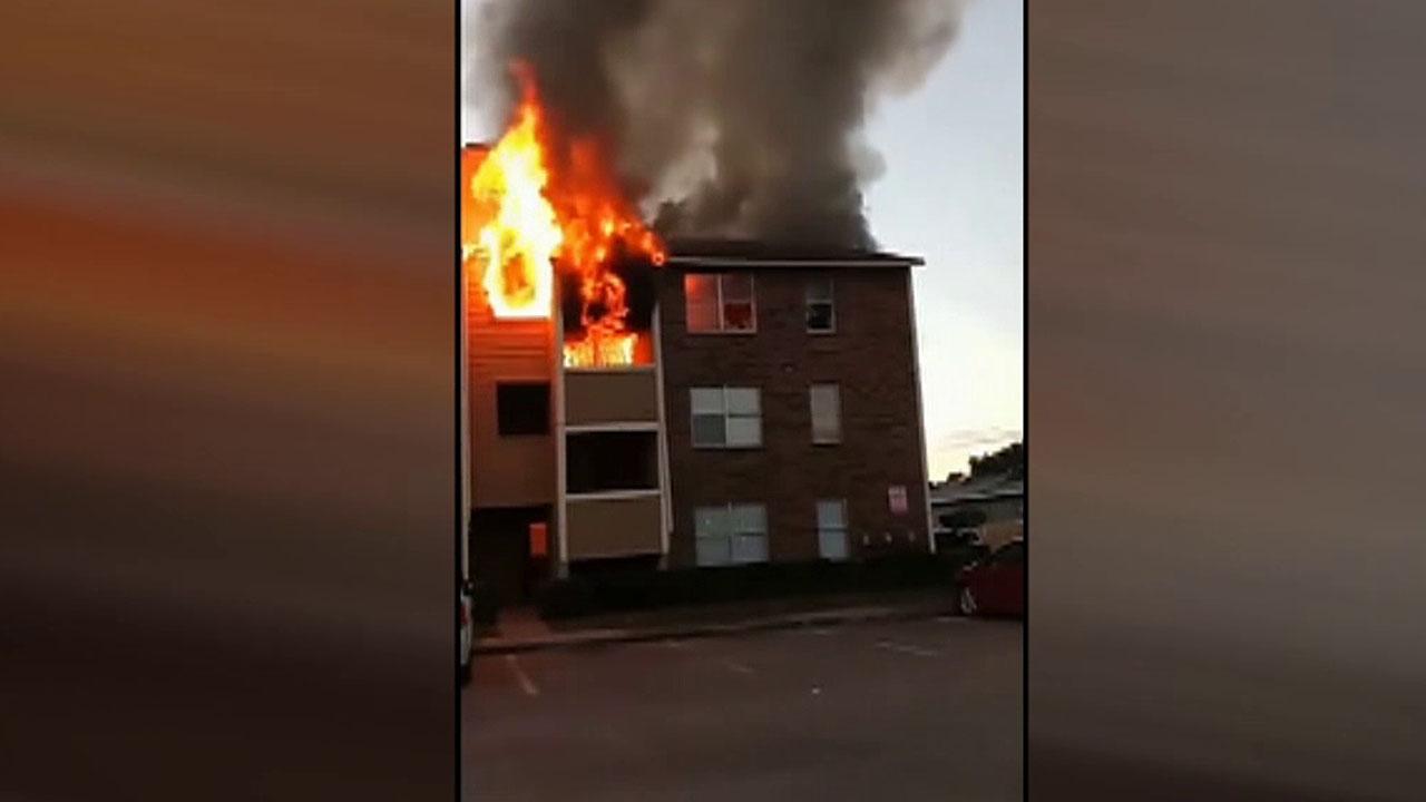 Raw Video: People jump to escape burning building