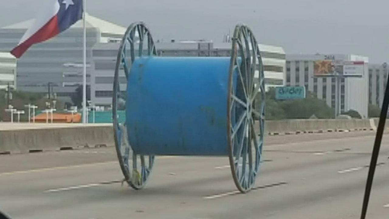 Giant industrial spool rolls down Houston highway