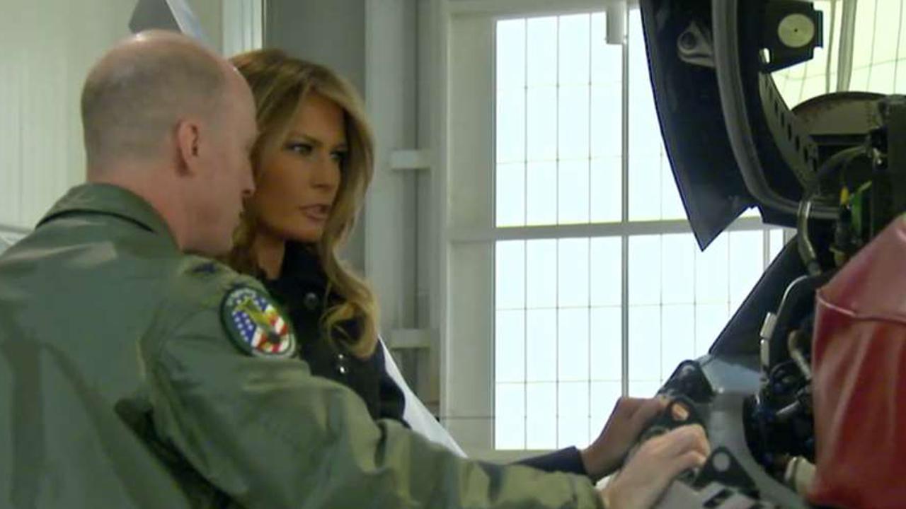 Melania Trump tours military bases and Navy aircraft carrier