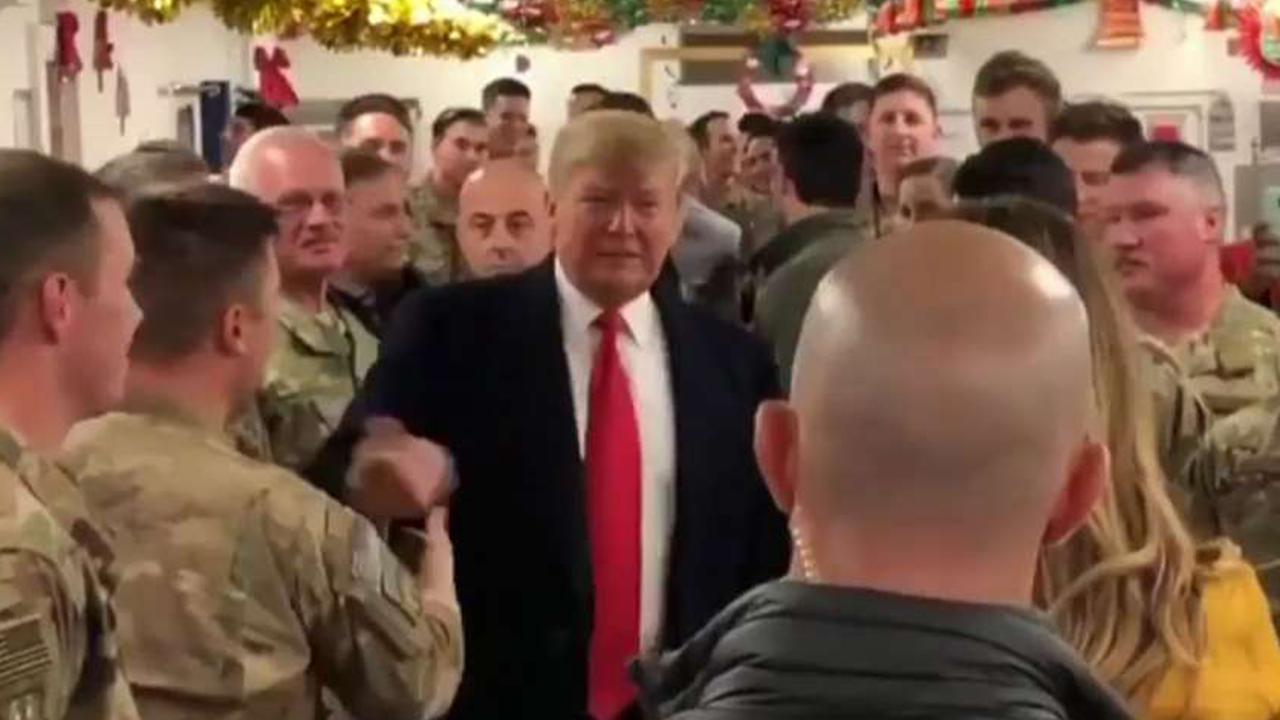 President Trump tweets video from his unannounced trip to visit US troops deployed to Iraq