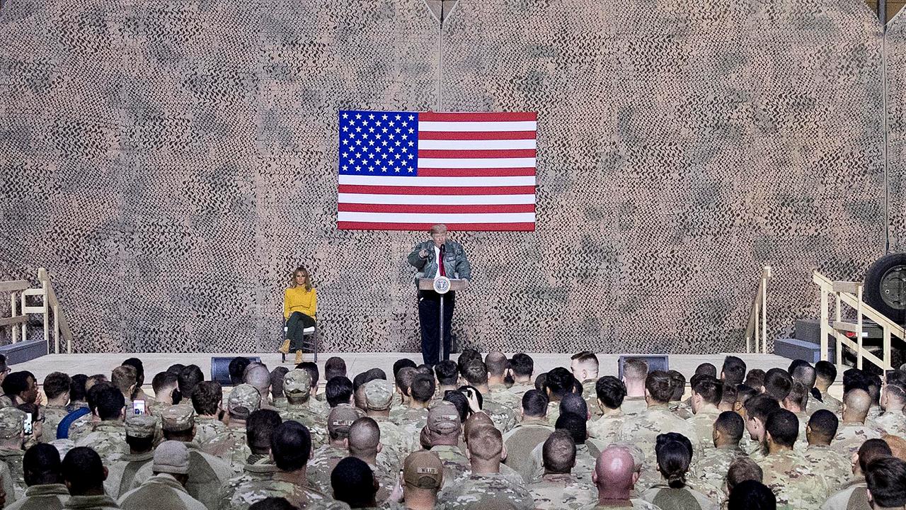 President Trump tells troops in Iraq that Americans are 'no longer the suckers' and that the US is 'respected again'