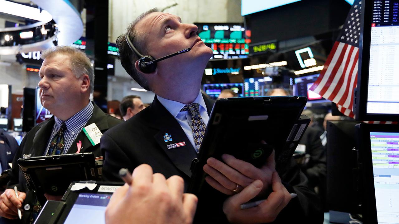 Wild swings on Wall Street: What does the stock market's volatility in 2018 mean for investors in the new year?