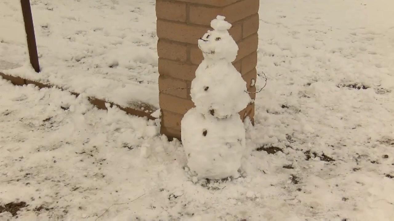 Residents of Vail, Arizona enjoy a rare snow storm