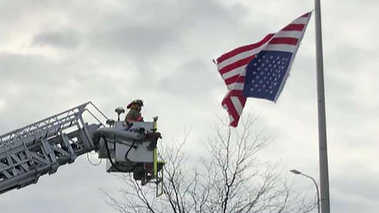 Missouri police officer enlists fire department to fix American flag hanging upside-down