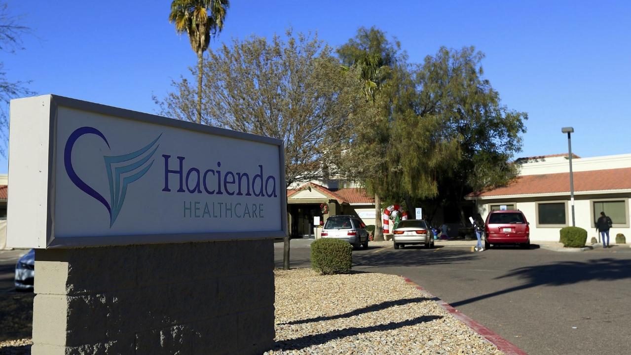Two doctors leave the Hacienda HealthCare facility where a patient in a vegetative state gave birth