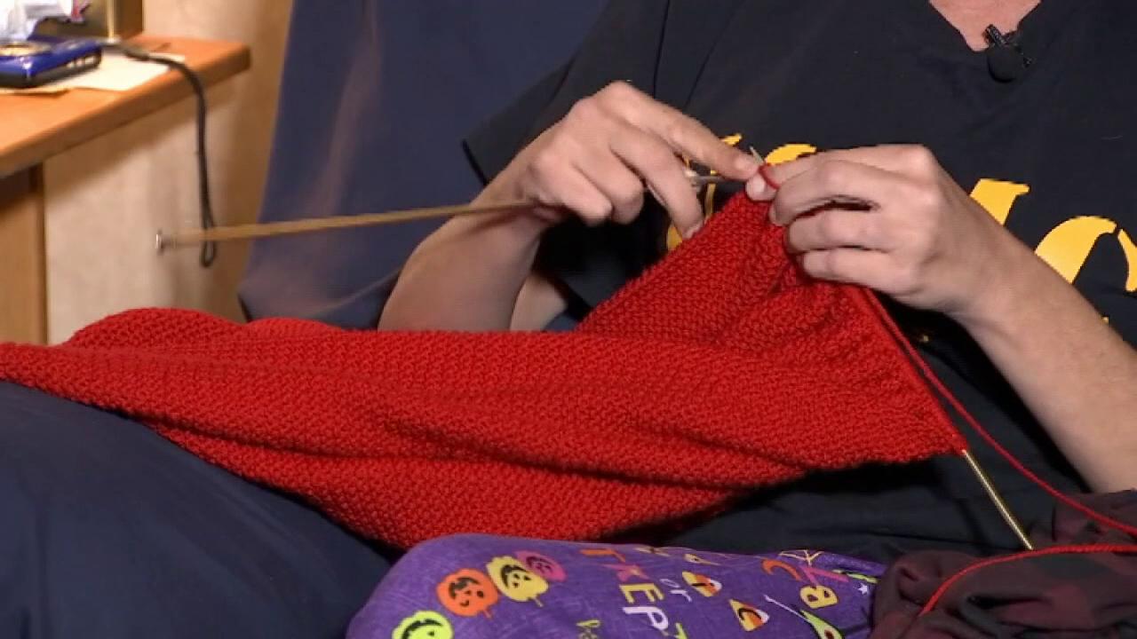 Florida woman knits huge flag to honor the service of military veterans.