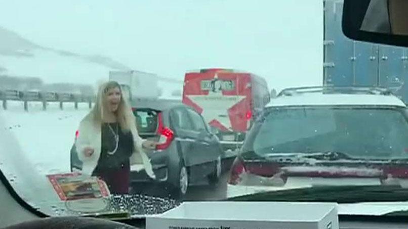 Mother seen dancing to Backstreet Boys during snowy, gridlocked traffic