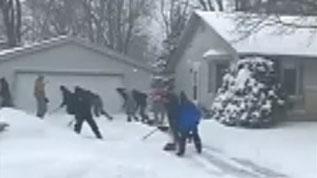 Wisconsin high school wrestling team spends snow day helping neighbors shovel snow