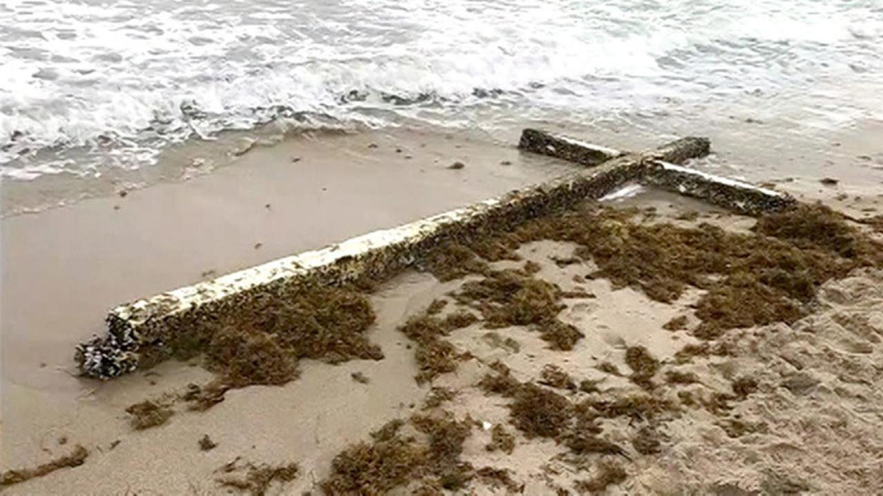 Giant cross washes up on FL beach