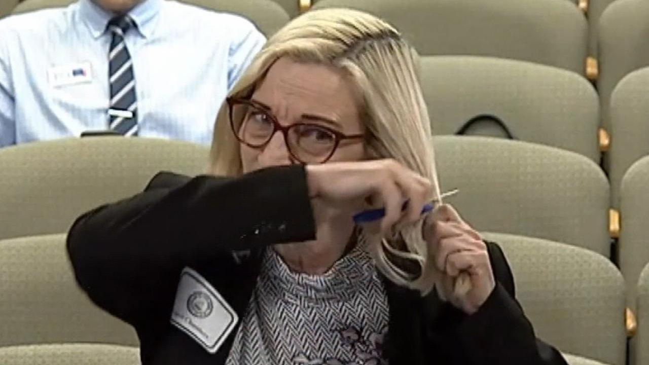 Woman chops her hair off during city council meeting to bring awareness to saving trees