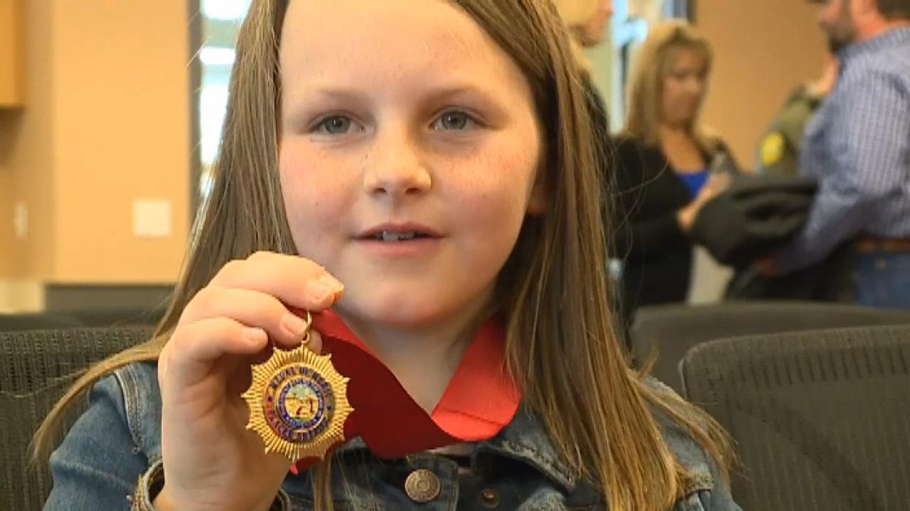 8-year-girl honored for saving her injured father's life during shooting spree in California