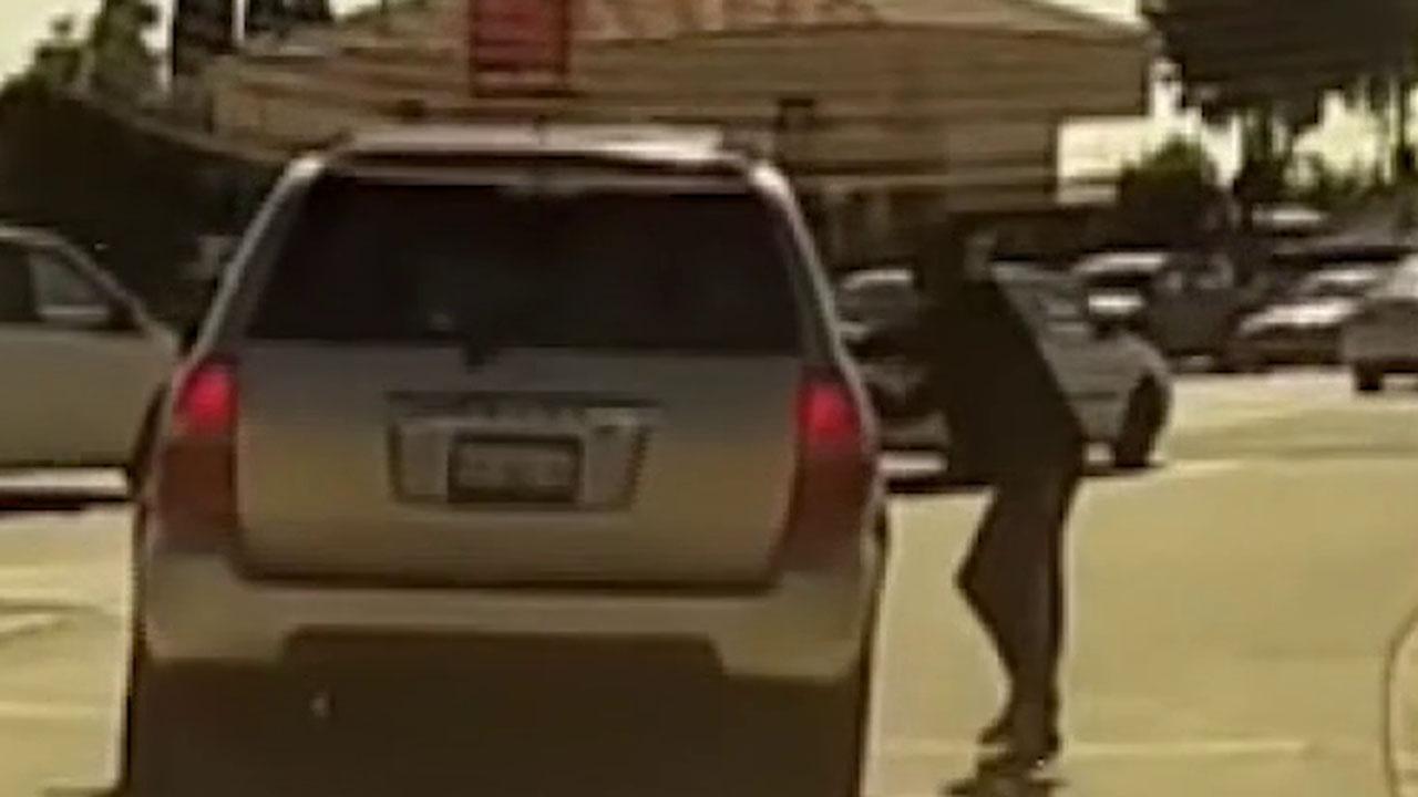 Dashcam video records a pedestrian intentionally trying to get hit by a vehicle