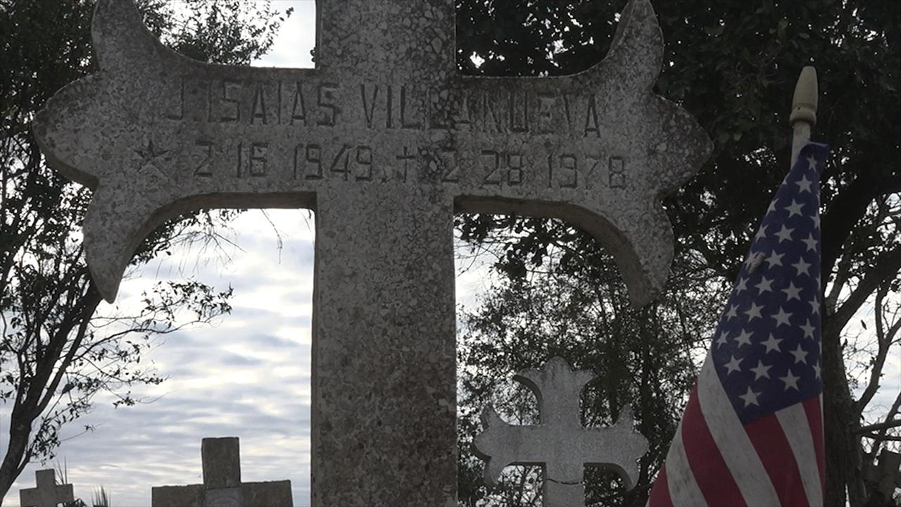 Historic cemetery separated by border wall