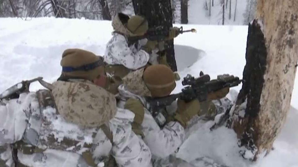 Marines train in snowy mountain conditions as US military steps up winter-warfare training