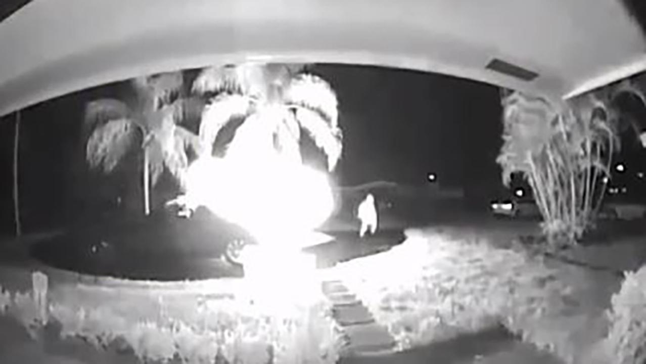 Surveillance camera catches hooded suspect setting fire to Florida woman's car