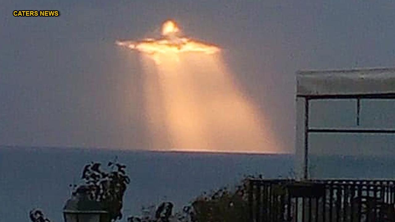 Man captures image of Jesus shining through the clouds: 'I was enchanted'